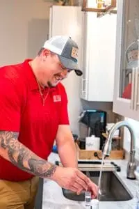 Plumber testing kitchen water for hard water levels in Murfreesboro TN