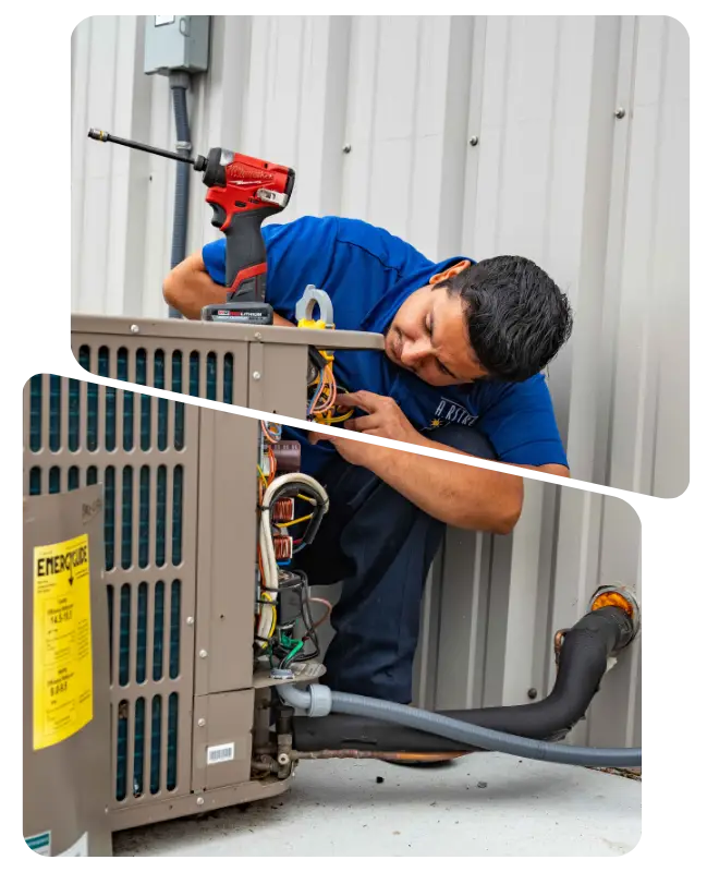 HVAC technician performing maintenance on an outdoor air conditioning unit with a drill.