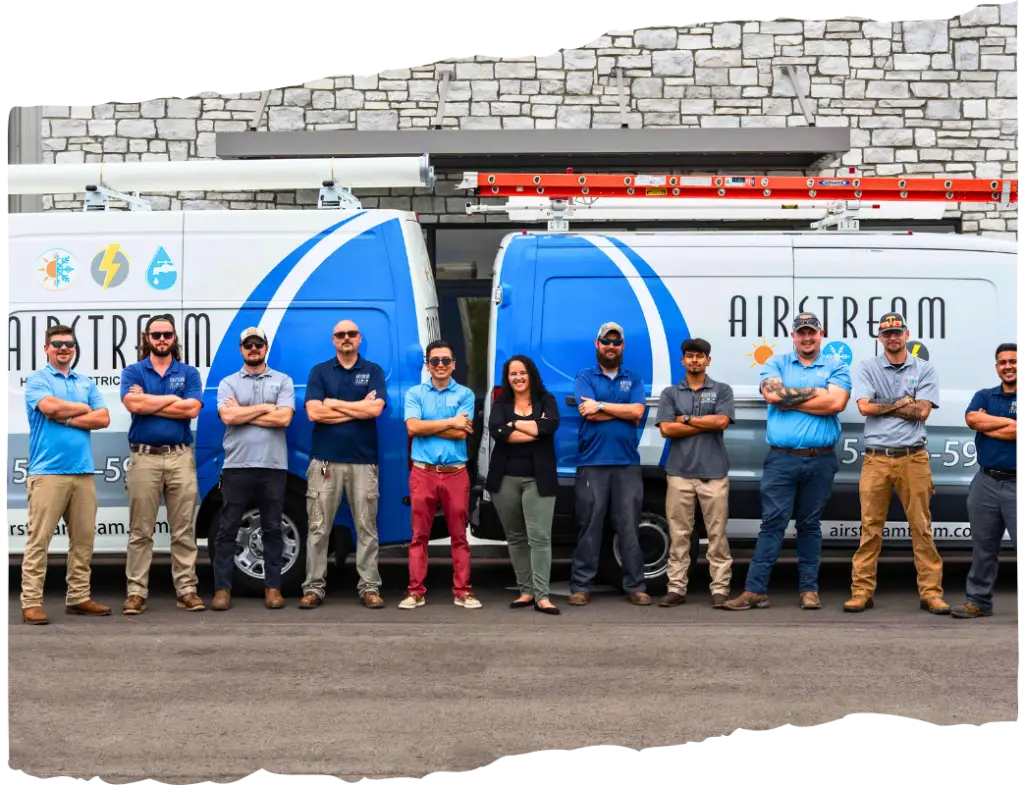 Airstream Plumbing, Heating & Air team members posing with folded arms in front of two branded service vans.