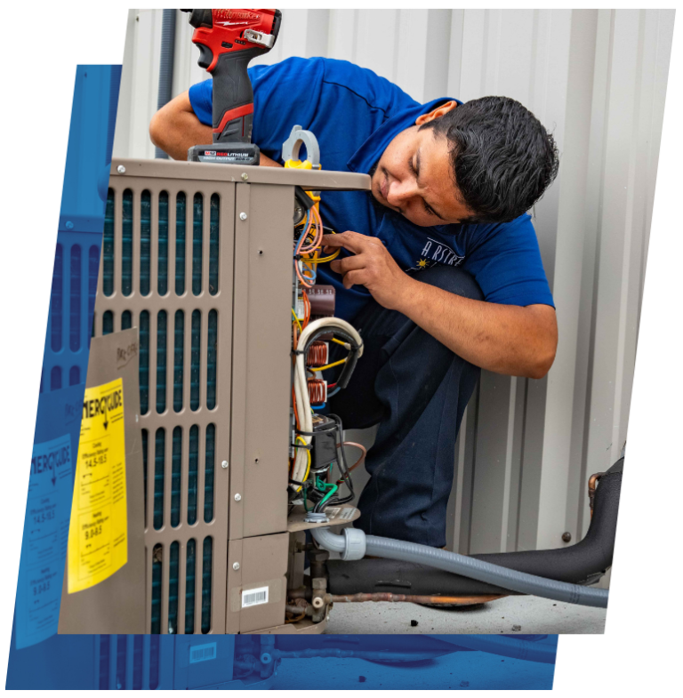 HVAC technician diagnosing an outdoor air conditioning unit with a power drill.